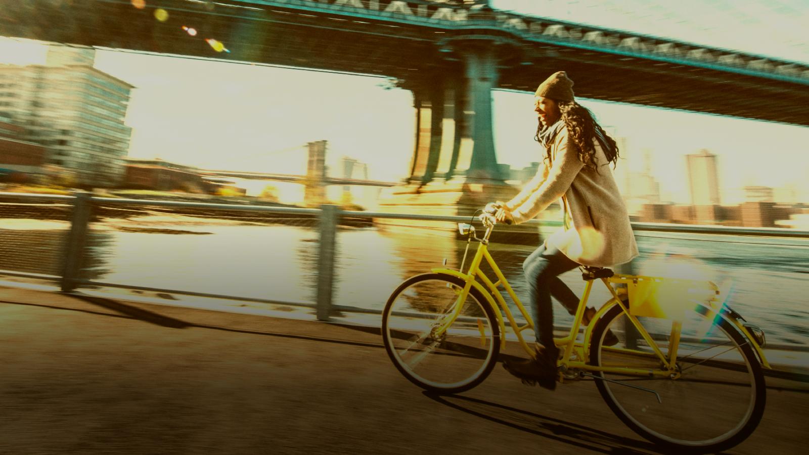 woman cycling yellow bicycle